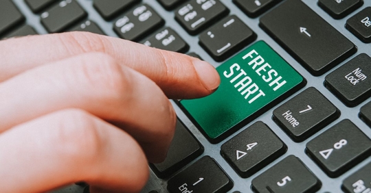 FINGER ABOUT TO PRESS SETUP BUTTON